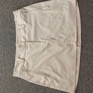 Ecru colored skort with zippered pockets